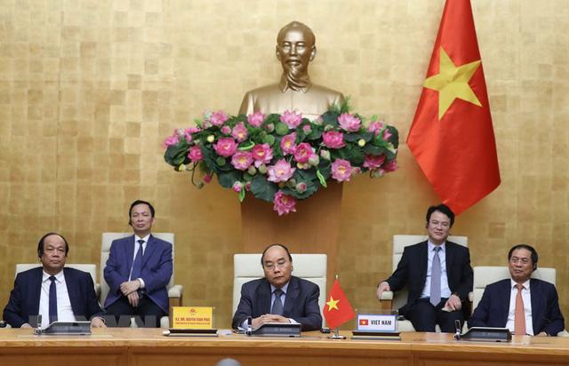 Họp trực tuyến G20, Thủ tướng chia sẻ nhiều biện pháp hành động chung ứng phó COVID-19 - Ảnh 1.